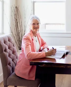 Cynthia Maguire seated